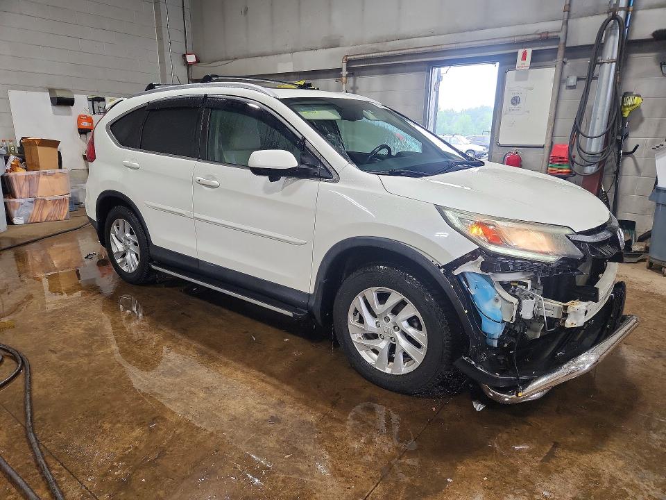Photo 4 from auction – 2015 HONDA CR-V with VIN 5J6RM4H75FL071216