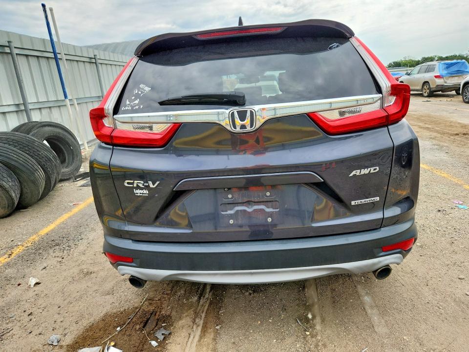Photo 6 from auction – 2017 HONDA CR-V with VIN 5J6RW2H97HL014230