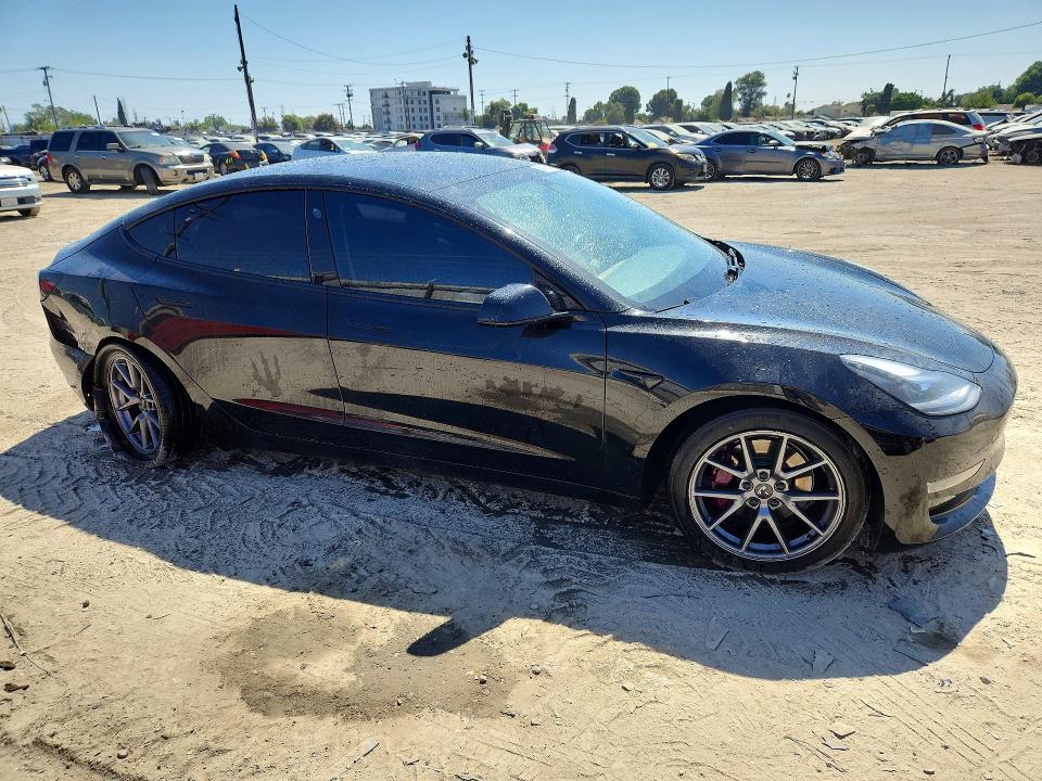 Photo 4 from auction – 2021 TESLA MODEL 3 with VIN 5YJ3E1EB5MF068087