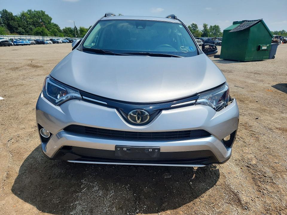 Photo 5 from auction – 2018 TOYOTA RAV4 with VIN 2T3RFREV2JW704955