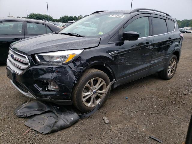 FORD ESCAPE SE 2018 with VIN 1FMCU9GD8JUC83607 - Photo from auction