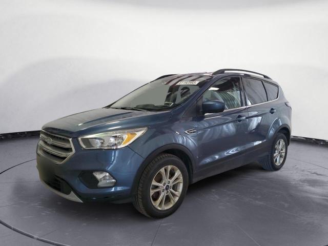 FORD ESCAPE SE 2018 with VIN 1FMCU0GD0JUB46057 - Photo from auction