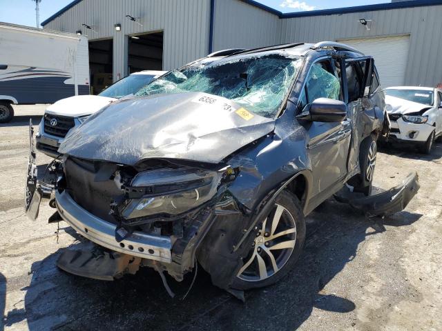 HONDA PILOT TOUR 2018 with VIN 5FNYF6H98JB027327 - Photo from auction