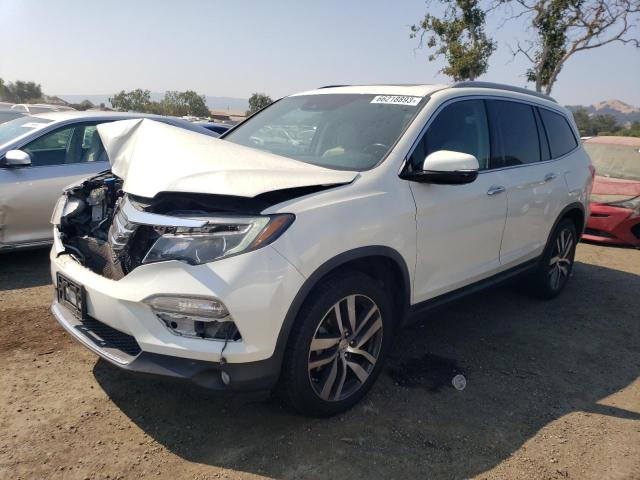 HONDA PILOT TOUR 2016 with VIN 5FNYF5H99GB018980 - Photo from auction