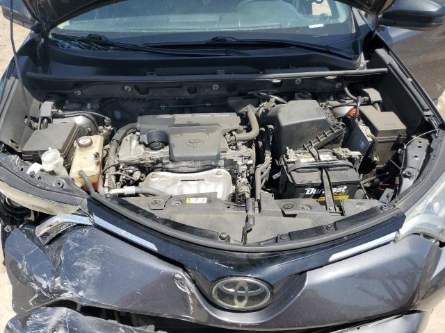 Photo 12 from auction – 2018 TOYOTA RAV4 LE with VIN JTMZFREV8JJ211571