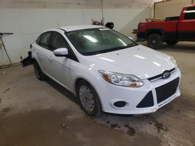 Foto 4 de la subasta – 2014 FORD FOCUS SE con VIN 1FADP3F23EL119714