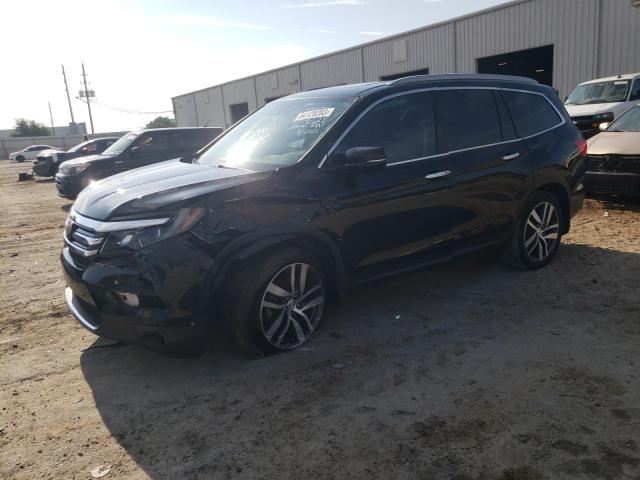HONDA PILOT TOUR 2018 with VIN 5FNYF5H93JB003057 - Photo from auction