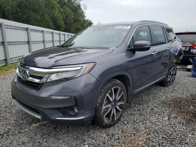 HONDA PILOT TOUR 2021 with VIN 5FNYF6H90MB072069 - Photo from auction