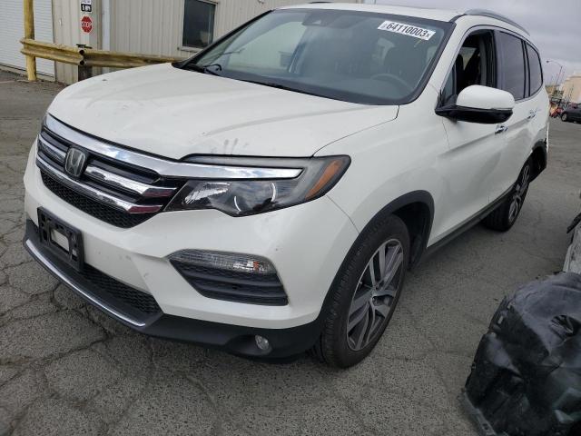 HONDA PILOT TOUR 2018 with VIN 5FNYF5H95JB030843 - Photo from auction