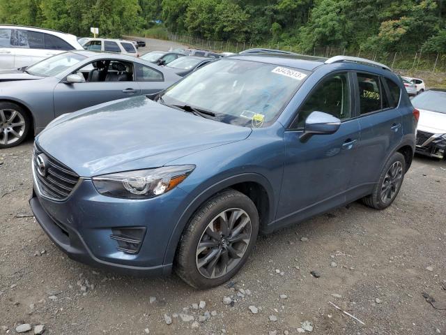 MAZDA CX-5 GT 2016 with VIN JM3KE4DY0G0648053 - Photo from auction