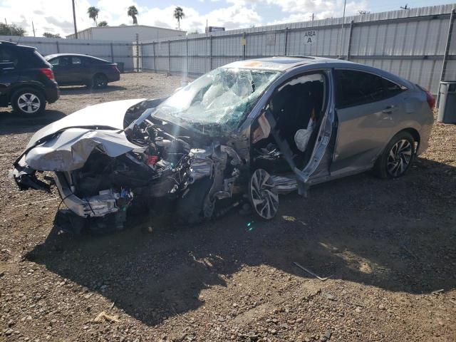 HONDA CIVIC EX 2018 with VIN 19XFC2F77JE016982 - Photo from auction