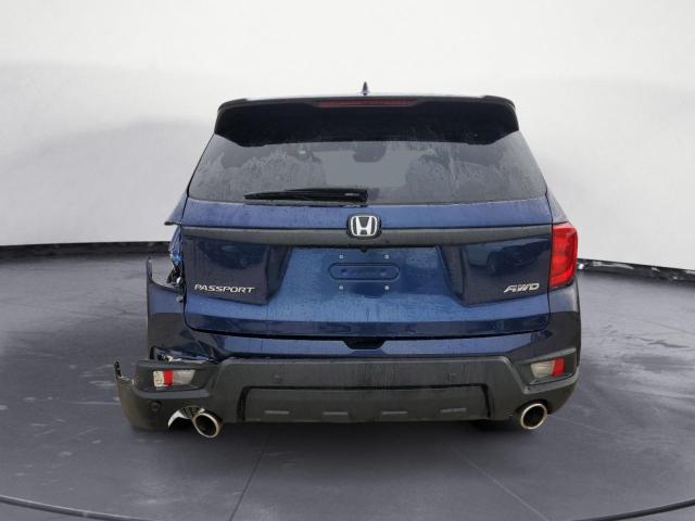 Photo 6 from auction – 2022 HONDA PASSPORT E with VIN 5FNYF8H53NB018842