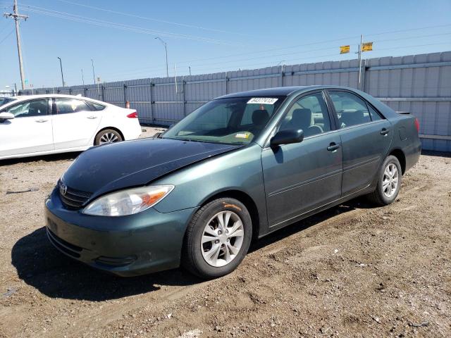 TOYOTA CAMRY LE 2004 with VIN 4T1BF32K94U075118 - Photo from auction