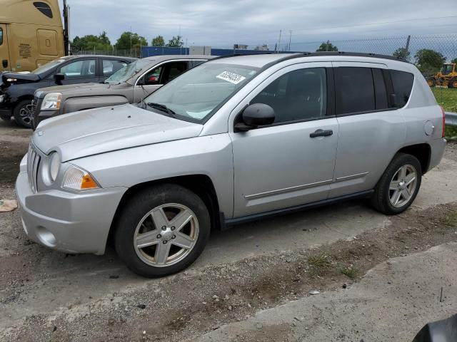 JEEP COMPASS SP 2010 with VIN 1J4NF1FB6AD623050 - Photo from auction