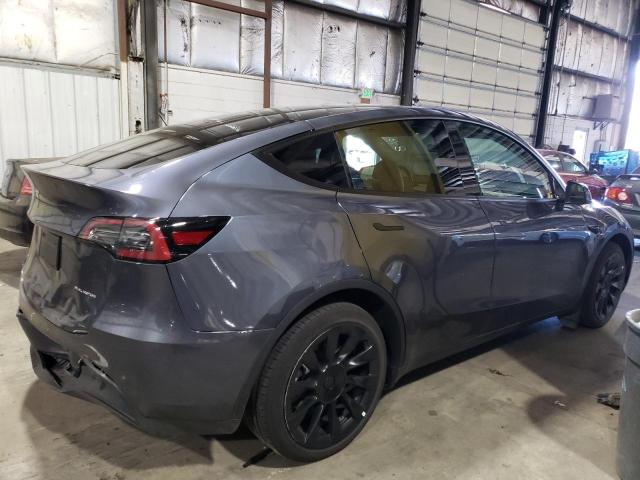 Снимка 3 от търг – 2023 TESLA MODEL Y с VIN 7SAYGAEE4PF699656