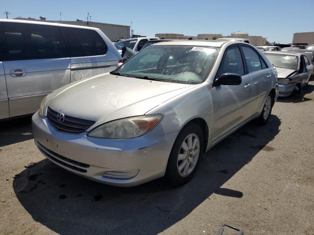 TOYOTA CAMRY LE 2002 with VIN JTDBF30K920032796 - Photo from auction