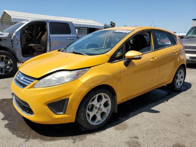 FORD FIESTA SES 2011 with VIN 3FADP4FJ7BM124390 - Photo from auction