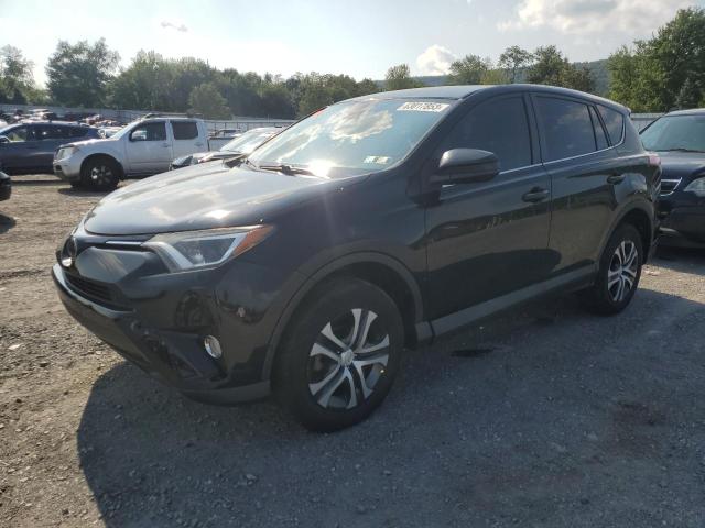 TOYOTA RAV4 LE 2018 with VIN 2T3BFREV9JW716294 - Photo from auction