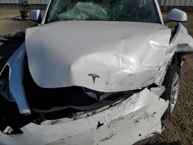 Photo 12 from auction – 2021 TESLA MODEL Y with VIN 5YJYGDEE7MF239630