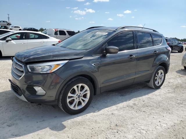 FORD ESCAPE SE 2018 with VIN 1FMCU0GD0JUC18097 - Photo from auction