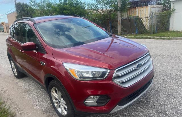FORD ESCAPE SE 2018 with VIN 1FMCU9GD7JUA77873 - Photo from auction