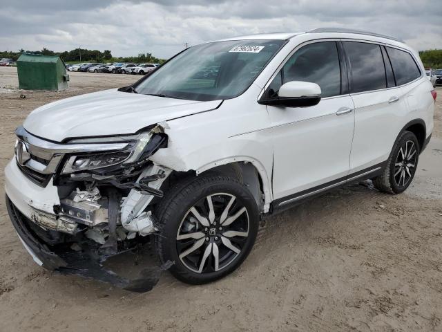 HONDA PILOT TOUR 2022 with VIN 5FNYF5H65NB030899 - Photo from auction