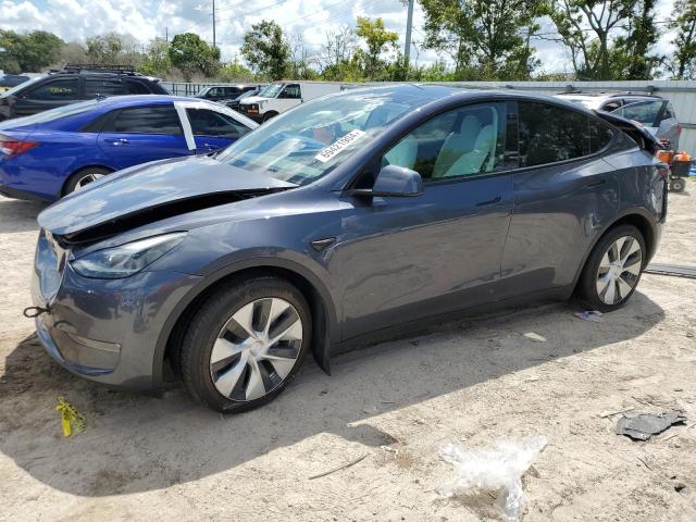 TESLA MODEL Y 2023 with VIN 7SAYGAEE6PF661104 - Photo from auction