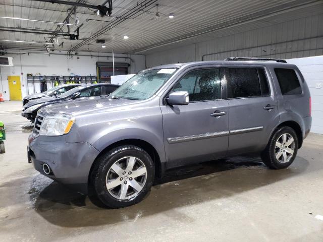 HONDA PILOT TOUR 2014 with VIN 5FNYF4H98EB007234 - Photo from auction