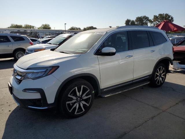 HONDA PILOT TOUR 2019 with VIN 5FNYF6H98KB083897 - Photo from auction