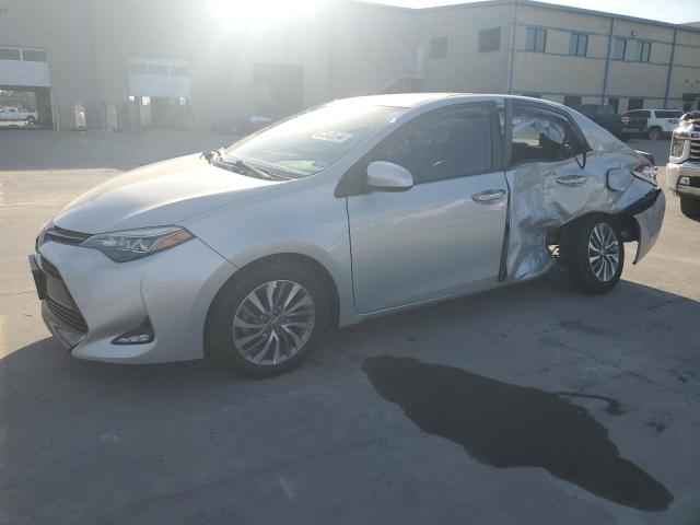 TOYOTA COROLLA L 2019 with VIN 5YFBURHE9KP935740 - Photo from auction