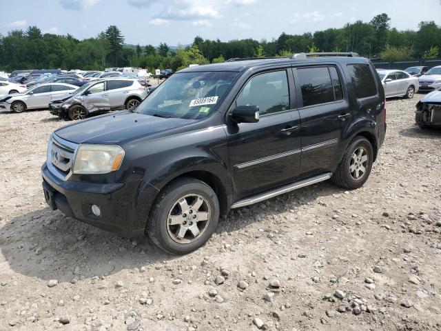 HONDA PILOT TOUR 2011 with VIN 5FNYF4H98BB071284 - Photo from auction
