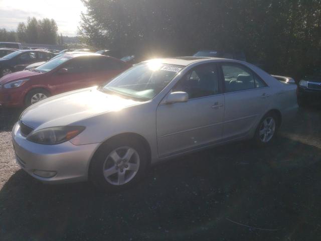 TOYOTA CAMRY LE 2003 with VIN 4T1BF30K03U556831 - Photo from auction