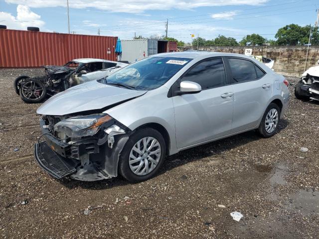 TOYOTA COROLLA L 2019 with VIN 5YFBURHE2KP869077 - Photo from auction