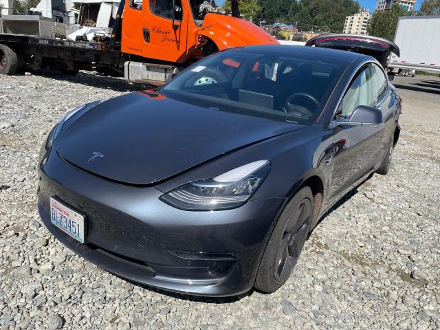 TESLA MODEL 3 2018 with VIN 5YJ3E1EAXJF101569 - Photo from auction