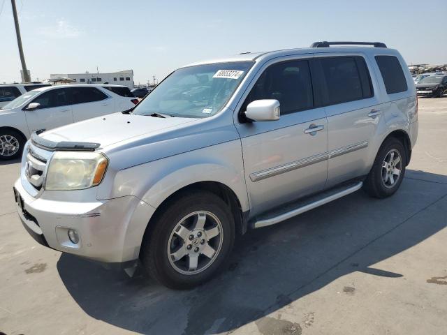 HONDA PILOT TOUR 2010 with VIN 5FNYF4H88AB033558 - Photo from auction