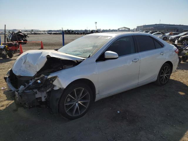 TOYOTA CAMRY LE 2017 with VIN 4T1BF1FKXHU303390 - Photo from auction
