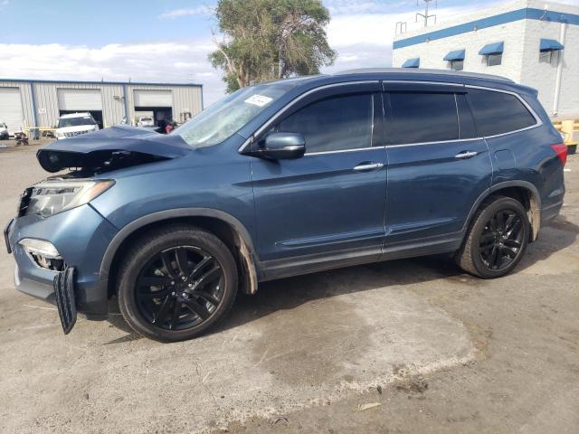 HONDA PILOT TOUR 2017 with VIN 5FNYF6H90HB017630 - Photo from auction