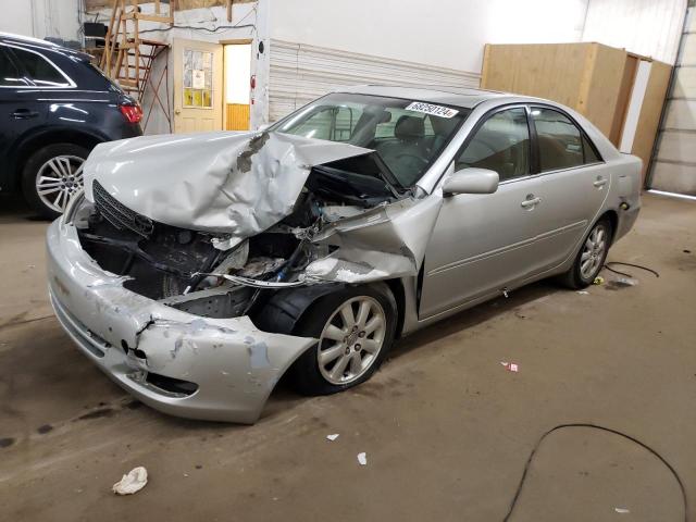 TOYOTA CAMRY LE 2004 with VIN 4T1BE30K24U297795 - Photo from auction