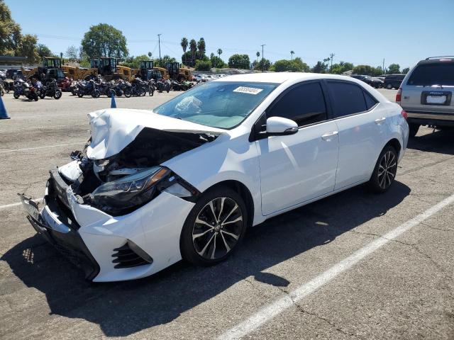 TOYOTA COROLLA L 2018 with VIN 5YFBURHE4JP760053 - Photo from auction