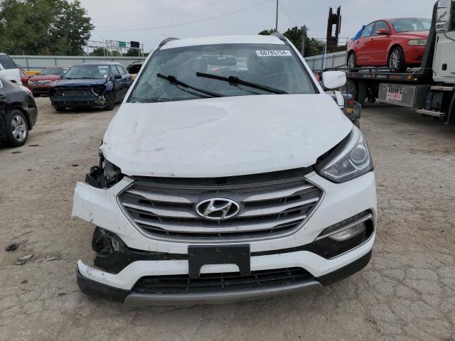 Photo 5 from auction – 2018 HYUNDAI SANTA FE S with VIN 5NMZU3LB0JH054183