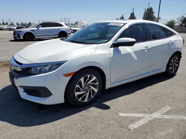 HONDA CIVIC EX 2018 with VIN 2HGFC2F74JH518970 - Photo from auction