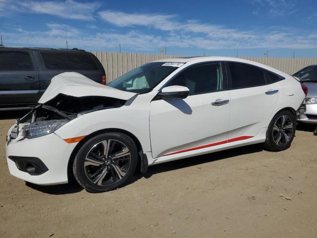 HONDA CIVIC TOUR 2016 with VIN 2HGFC1F99GH633956 - Photo from auction