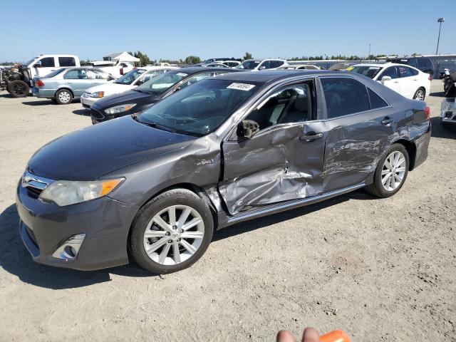 TOYOTA CAMRY HYBR 2012 with VIN 4T1BD1FK9CU021868 - Photo from auction