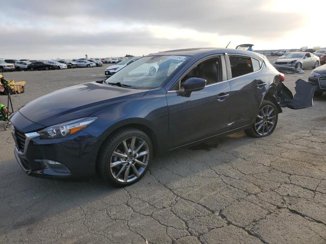 MAZDA 3 TOURING 2018 with VIN 3MZBN1L38JM228622 - Photo from auction