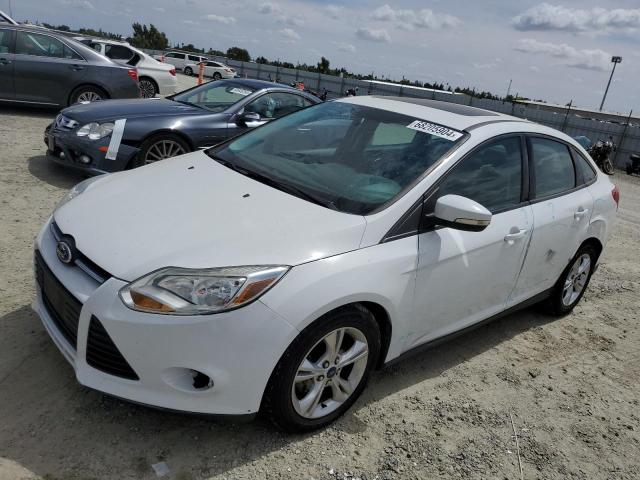 FORD FOCUS SE 2014 with VIN 1FADP3F24EL277141 - Photo from auction