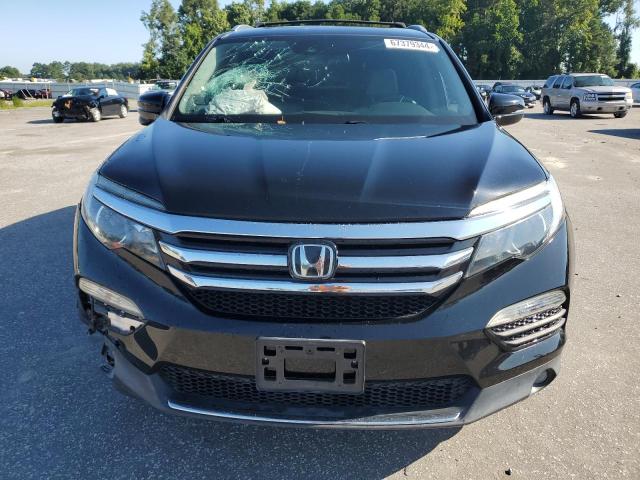 Photo 5 from auction – 2017 HONDA PILOT TOUR with VIN 5FNYF5H98HB008104