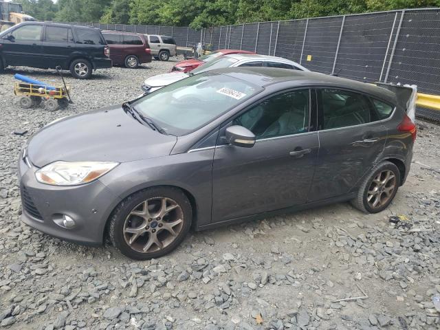 FORD FOCUS 2012 with VIN 1FAHP3M21CL335854 - Photo from auction