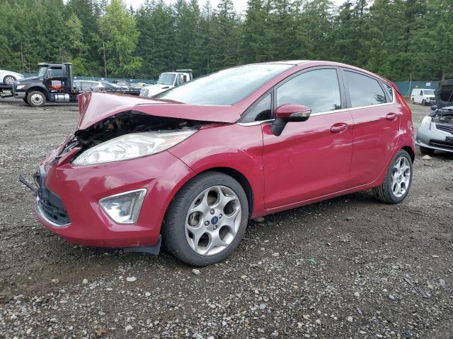 FORD FIESTA SES 2011 with VIN 3FADP4FJ0BM143167 - Photo from auction