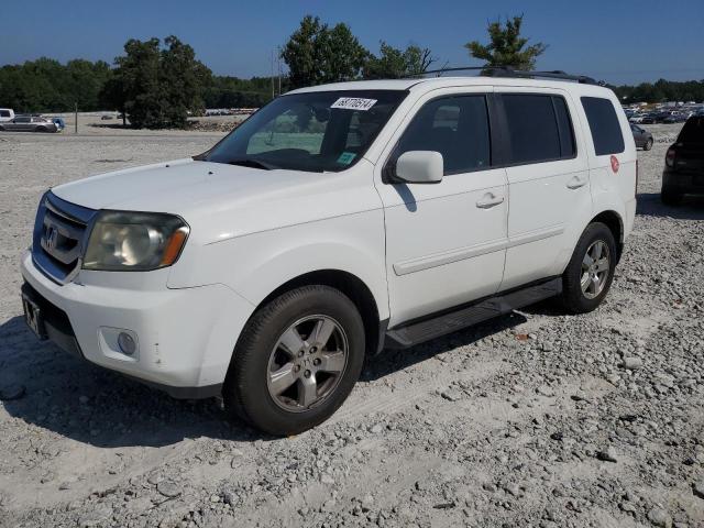 HONDA PILOT EXLN 2011 with VIN 5FNYF3H78BB011899 - Photo from auction
