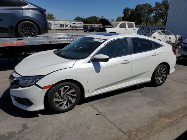 HONDA CIVIC EX 2018 with VIN 19XFC2F76JE202996 - Photo from auction